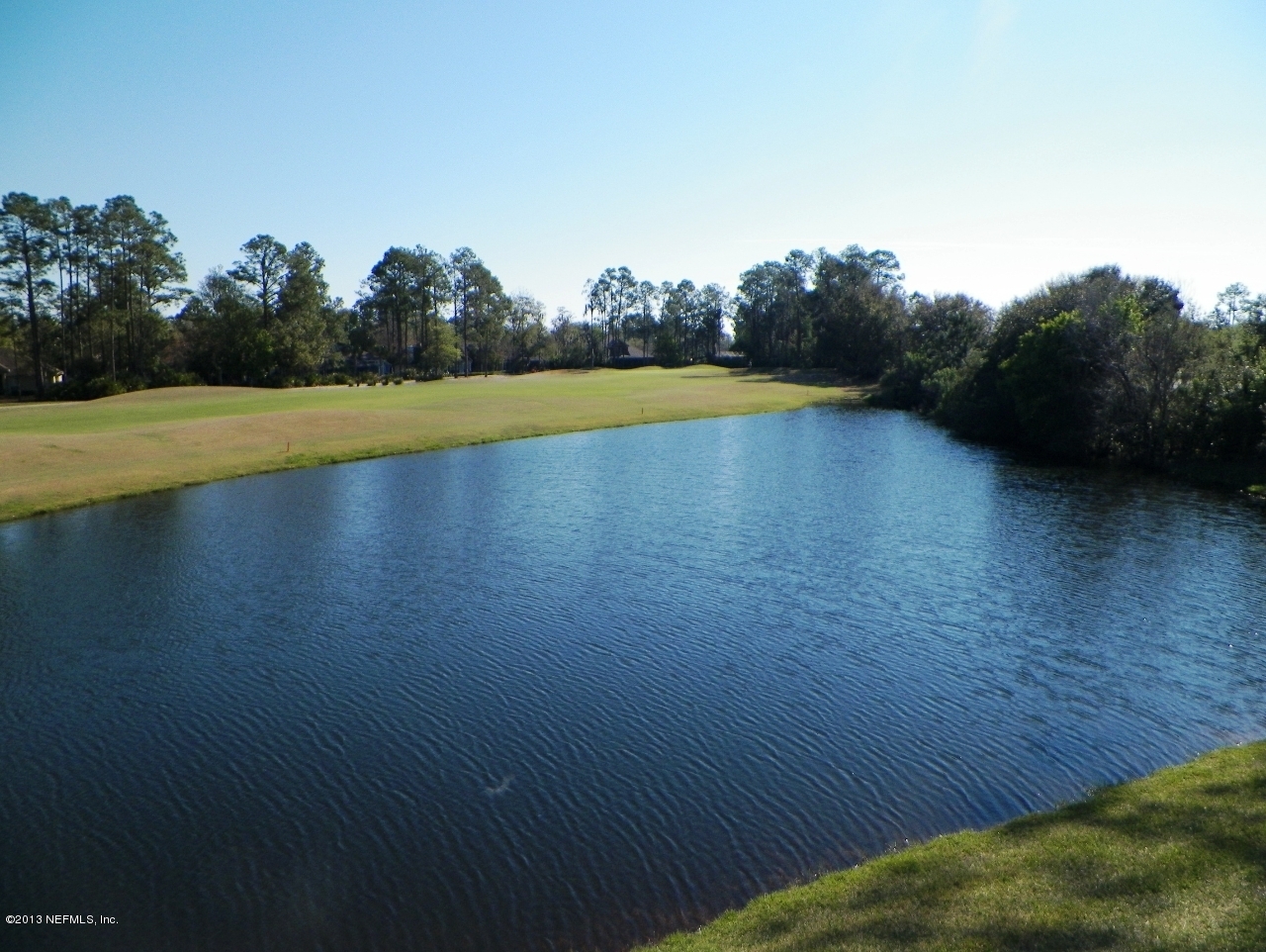 2002 Pond Ridge Court, Unit 1406 Fleming Island, FL 32003 - Photo 17 of 19 Lagoon_view from balcony