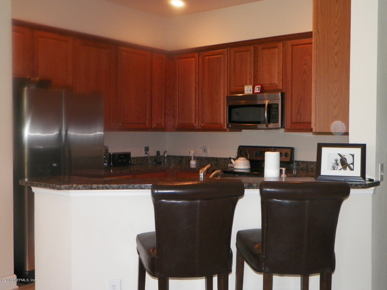 2002 Pond Ridge Court, Unit 1406 Fleming Island, FL 32003 - Photo 4 of 19 View of Kitchen