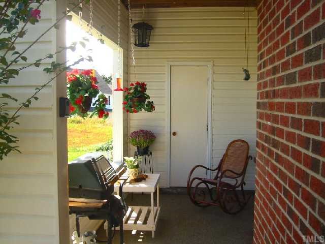 2110 Breezeway Drive, Unit 101 Raleigh, NC 27614 - Photo 11 of 12 Fantastic covered porch w/extra storage.