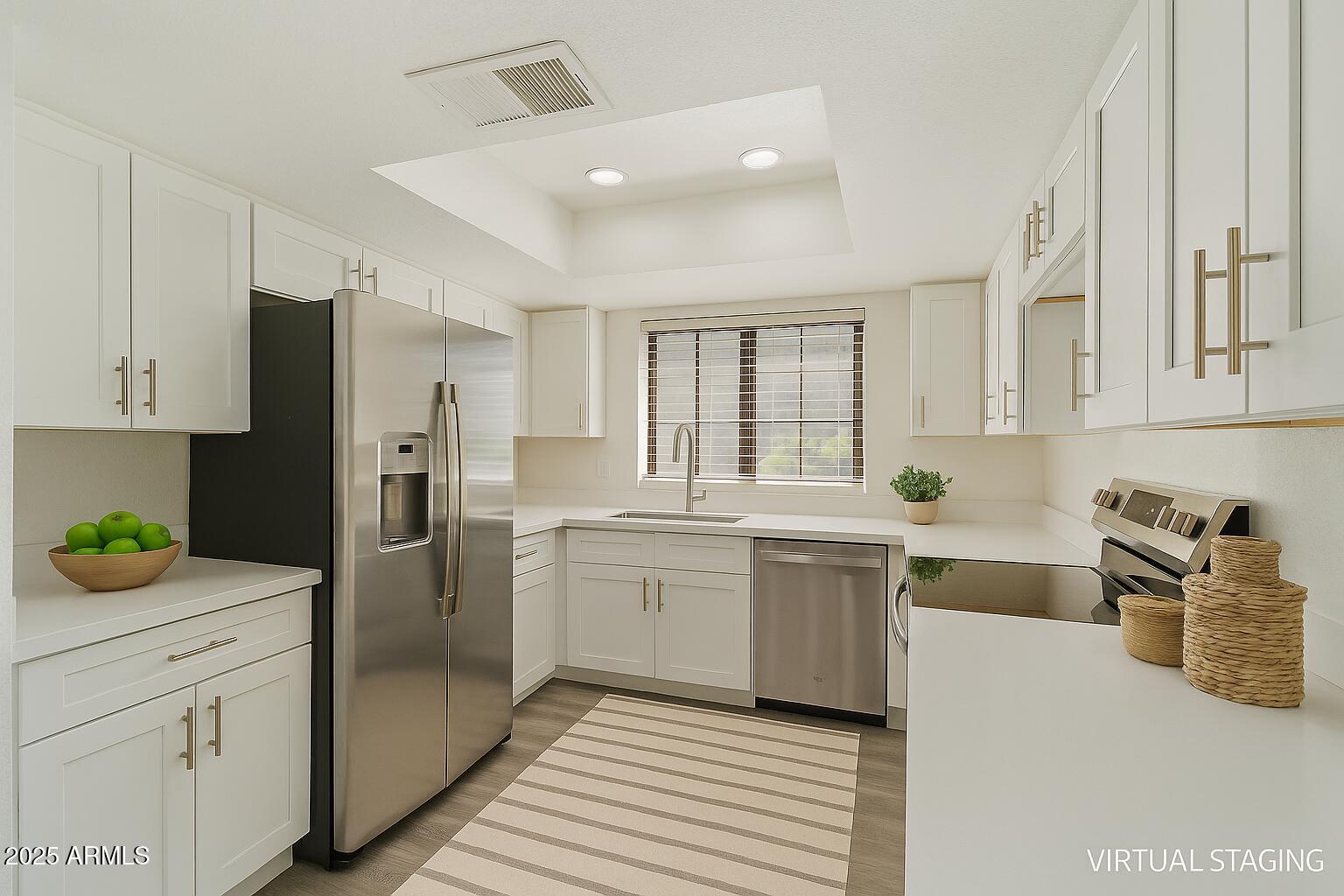 1905 East University Drive, Unit 133 Tempe, AZ 85288 - Photo 1 of 38 a kitchen with a sink dishwasher a refrigerator and white cabinets with wooden floor
