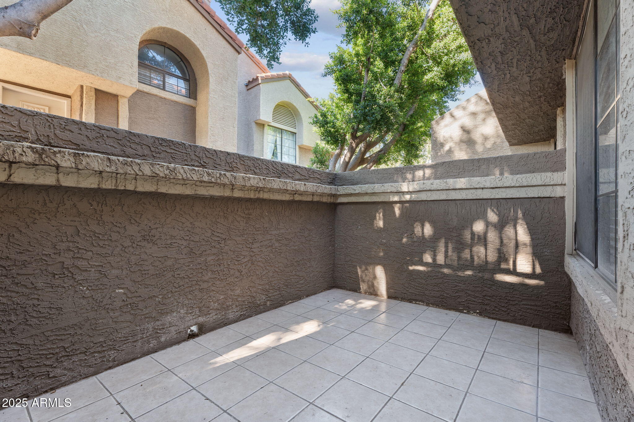 1905 East University Drive, Unit 133 Tempe, AZ 85288 - Photo 11 of 38 a view of a house with a balcony