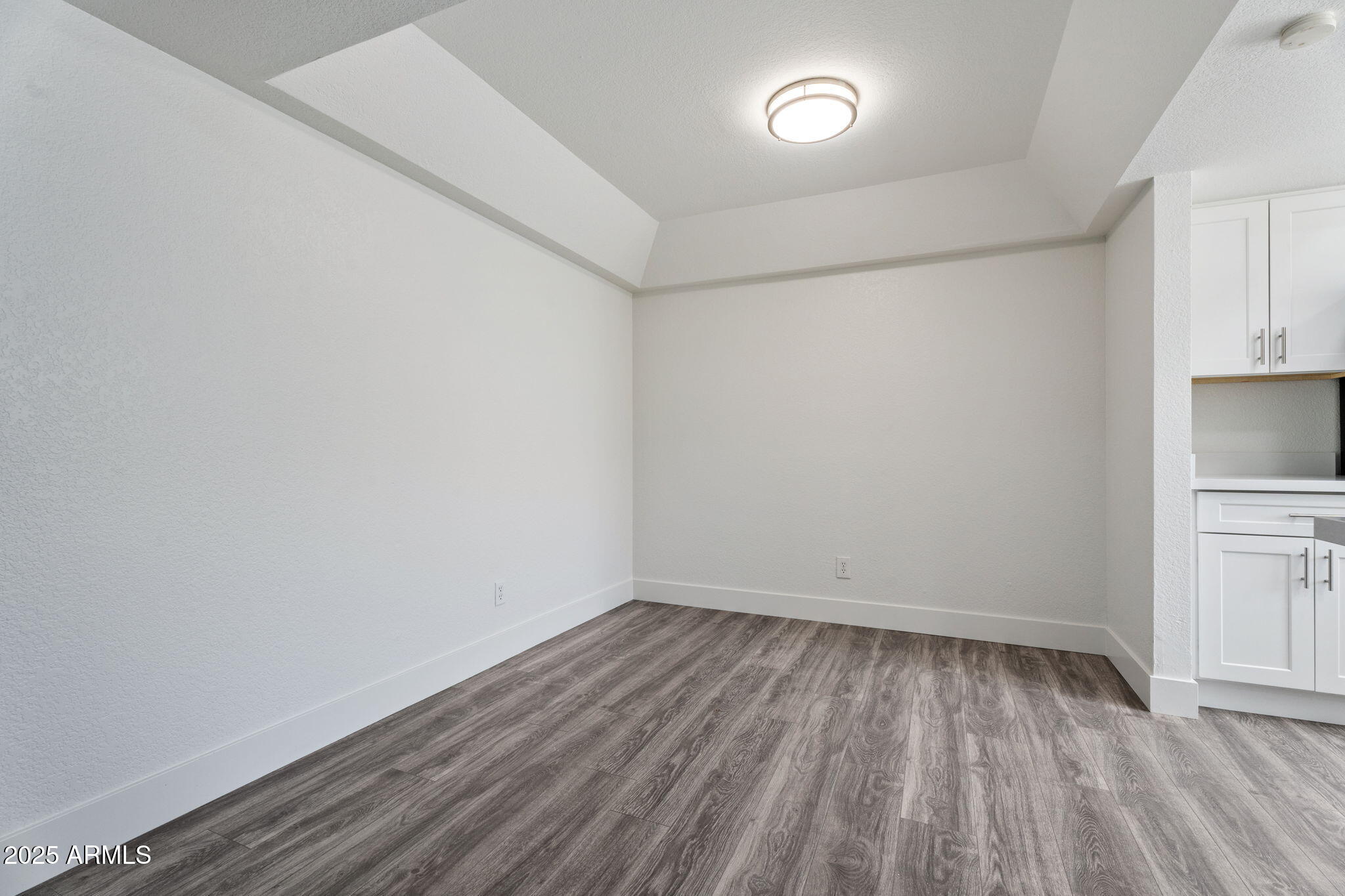 1905 East University Drive, Unit 133 Tempe, AZ 85288 - Photo 19 of 38 a view of empty room with wooden floor and fan