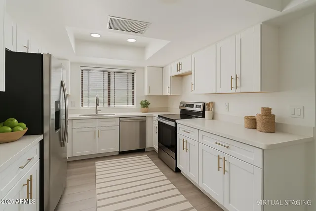 a kitchen with a sink stove and refrigerator