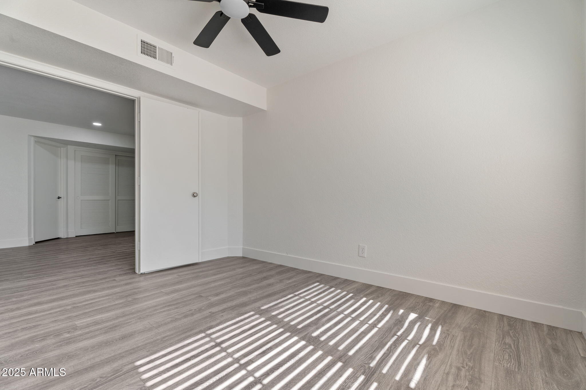 1905 East University Drive, Unit 133 Tempe, AZ 85288 - Photo 22 of 38 wooden floor in an empty room