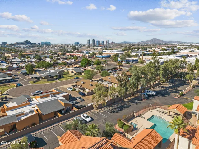 an aerial view of residential houses with outdoor space