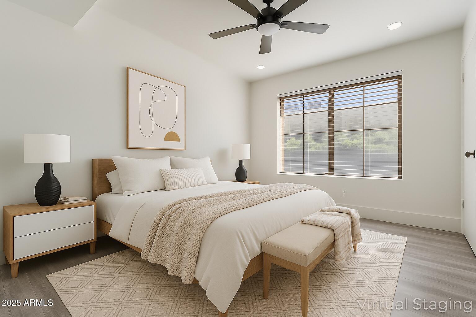 1905 East University Drive, Unit 133 Tempe, AZ 85288 - Photo 4 of 38 a bedroom with a bed and wooden floor