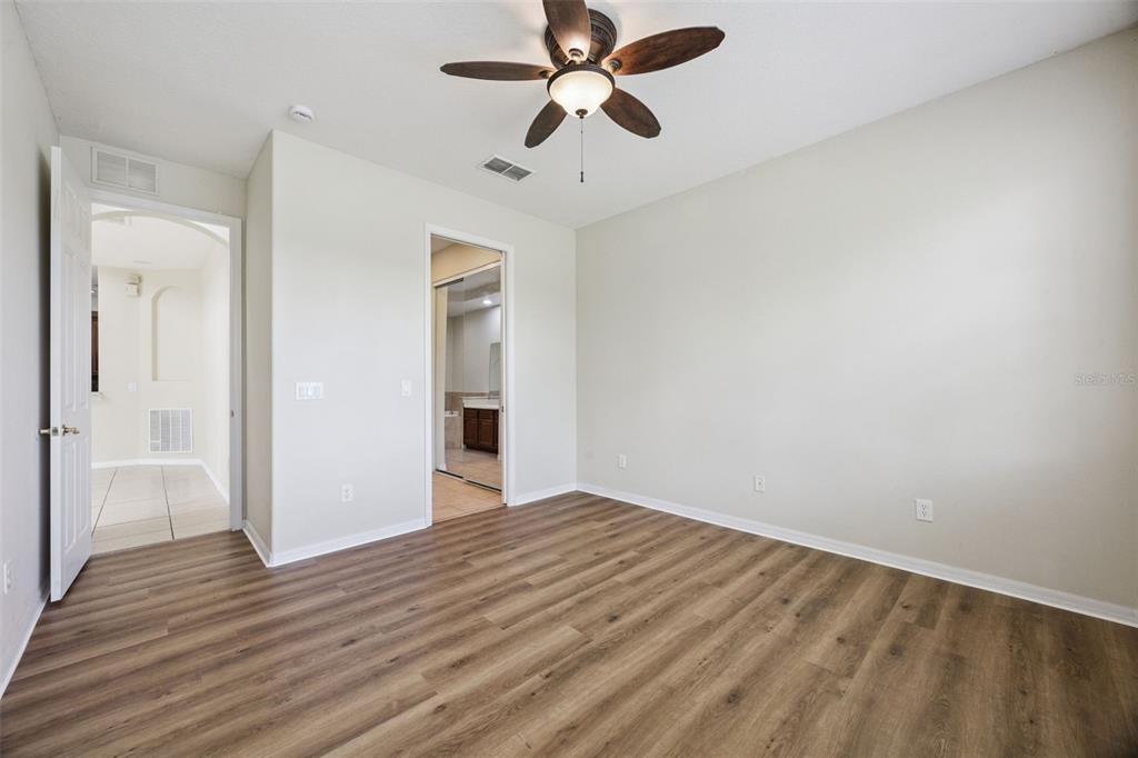 551 Terrace Spring Drive Orlando, FL 32828 - Photo 11 of 41 a view of empty room with wooden floor