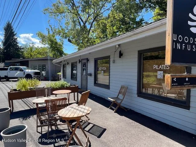 a view of a patio with table and chairs and potted plants