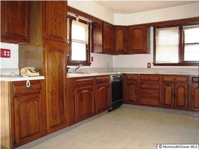 65 Thompson Bridge Road Jackson, NJ 08527 - Photo 2 of 3 a kitchen with a sink stove and cabinets