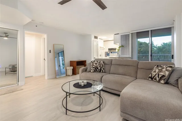 a living room with furniture and a large window