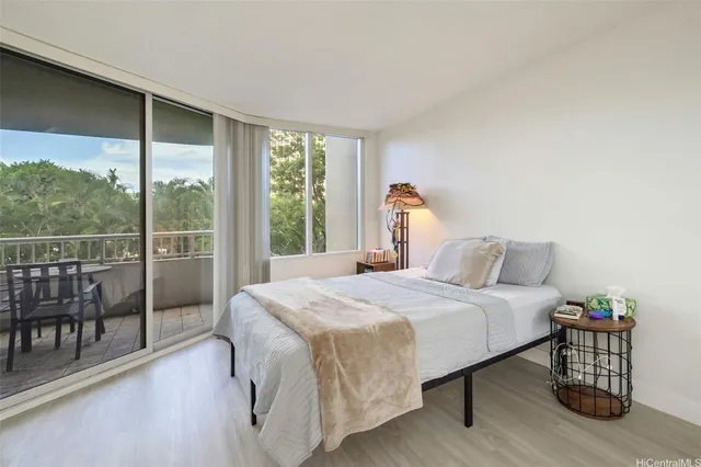 a bedroom with a bed and a table