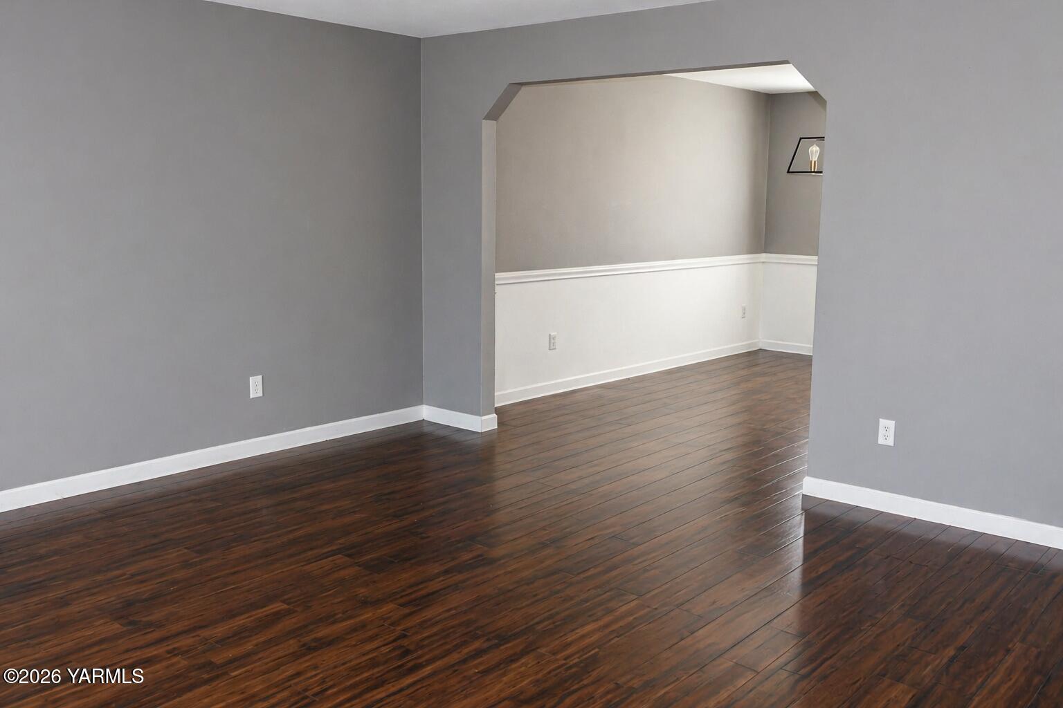514 Cascade Avenue Moxee, WA 98936 - Photo 4 of 25 a view of an empty room with wooden floor