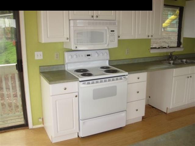 2715 Lower Kula Road Kula, HI 96790 - Photo 3 of 19 a kitchen with cabinets appliances and a sink