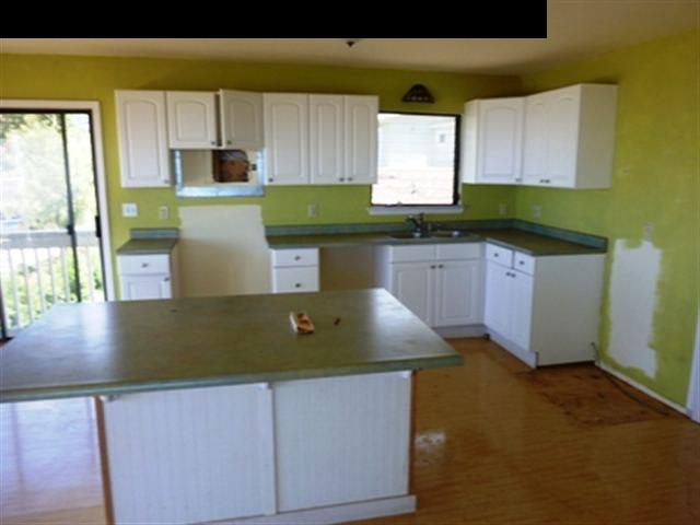 2715 Lower Kula Road Kula, HI 96790 - Photo 9 of 19 a kitchen with stainless steel appliances granite countertop a sink a stove and a granite counter tops