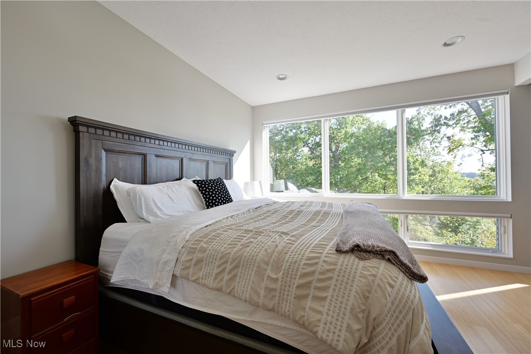 18875 Riversouth Fairview Park, Unit 30 Cleveland, OH 44126 - Photo 18 of 39 Bedroom featuring wood finished floors and lofted ceiling