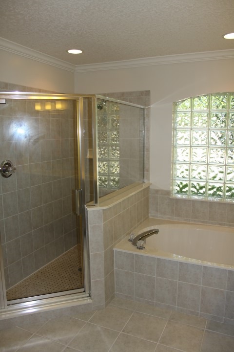 421 San Nicolas Way St. Augustine, FL 32080 - Photo 18 of 28 a bathroom with a bathtub and a shower