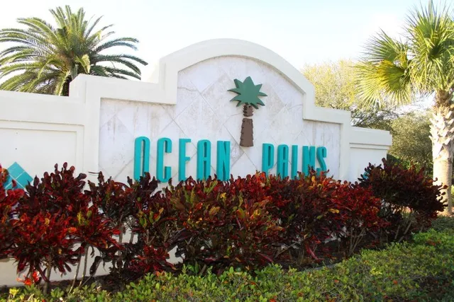 a bunch of flowers in front of house