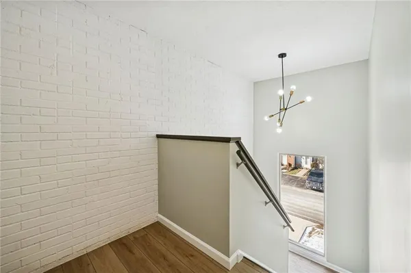 a bathroom with a double vanity sink toilet mirror and shower