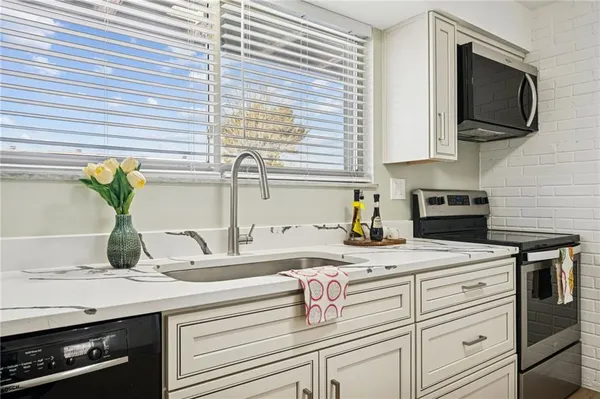 a kitchen with a stove and a microwave