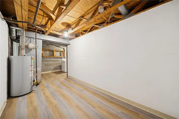a bathroom with a sink a mirror and a shower