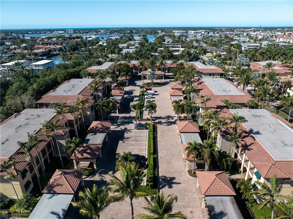 1045 Sandpiper Street, Unit G204 Naples, FL 34102 - Photo 26 of 40 an aerial view of multiple house