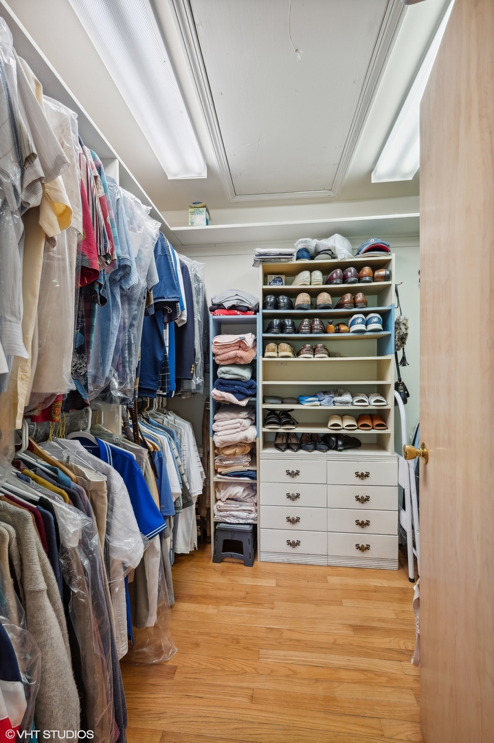 1404 Sequoia Trail Glenview, IL 60025 - Photo 27 of 46 a view of walk in closet with clothes and shoes