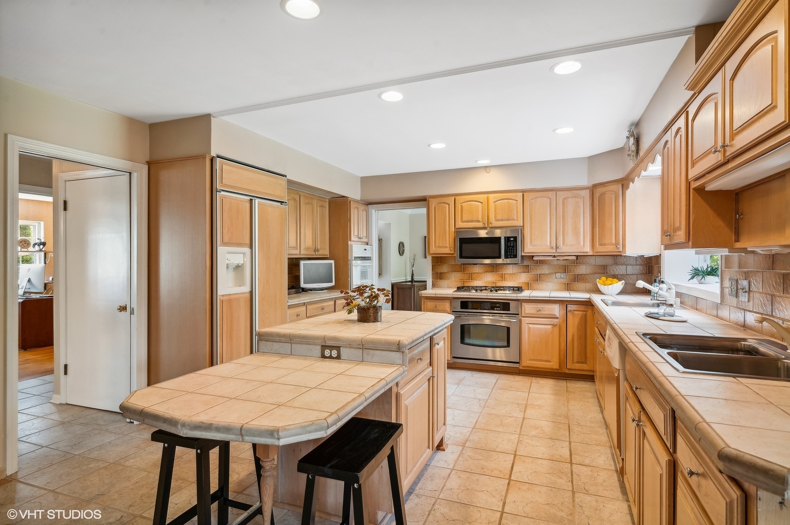 1404 Sequoia Trail Glenview, IL 60025 - Photo 10 of 46 a kitchen with a sink a counter top space stainless steel appliances and cabinets
