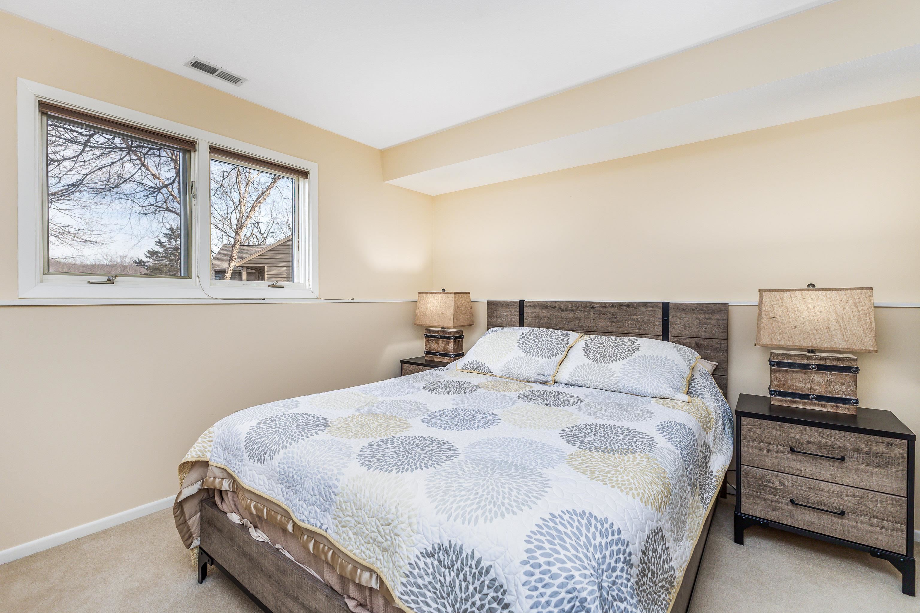 4 Timberline Drive Galena, IL 61036 - Photo 13 of 32 a bedroom with a bed and painting on the wall