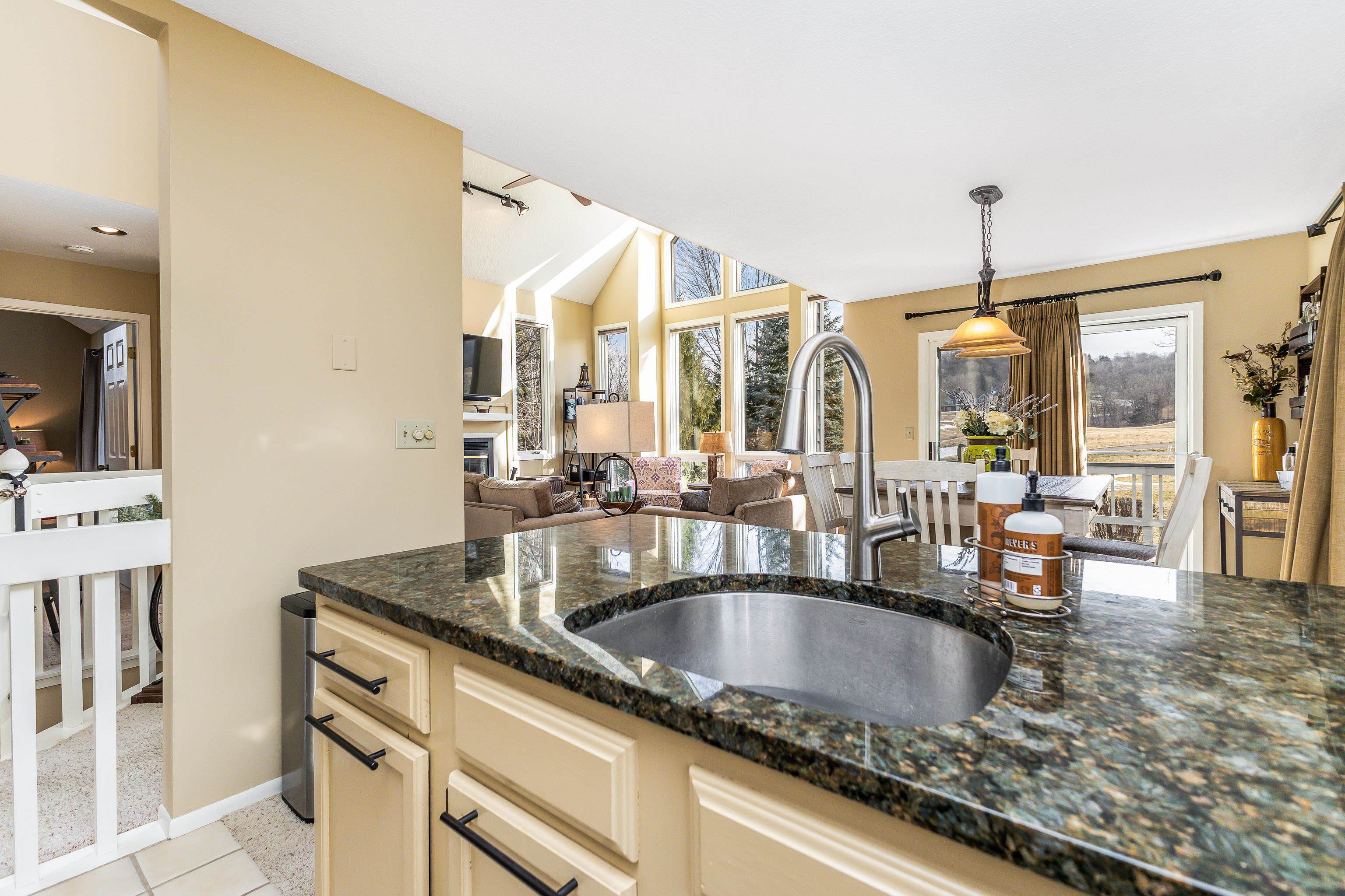 4 Timberline Drive Galena, IL 61036 - Photo 2 of 32 a kitchen with granite countertop a sink and cabinets