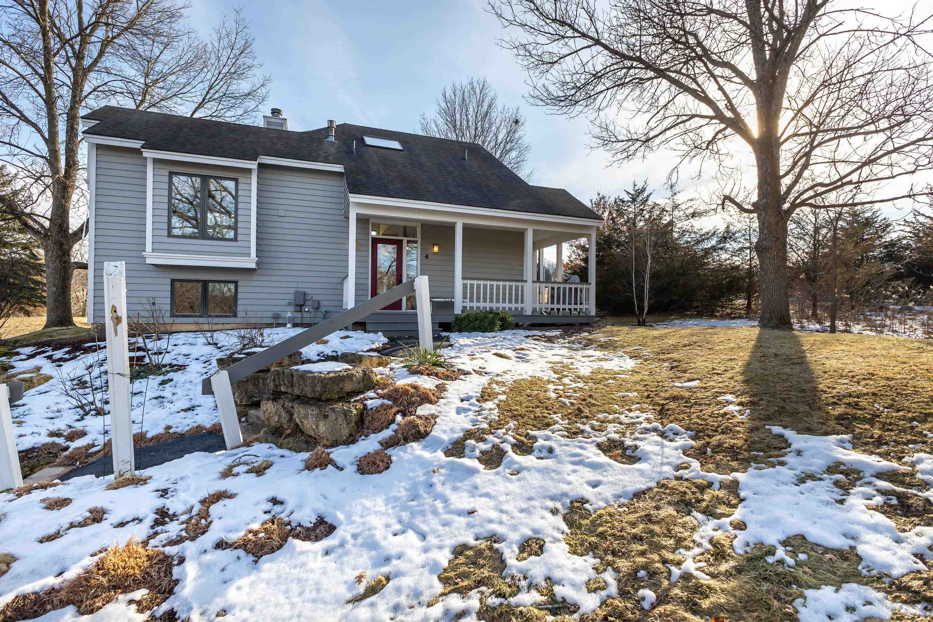 4 Timberline Drive Galena, IL 61036 - Photo 23 of 32 a front view of a house with a yard covered in snow