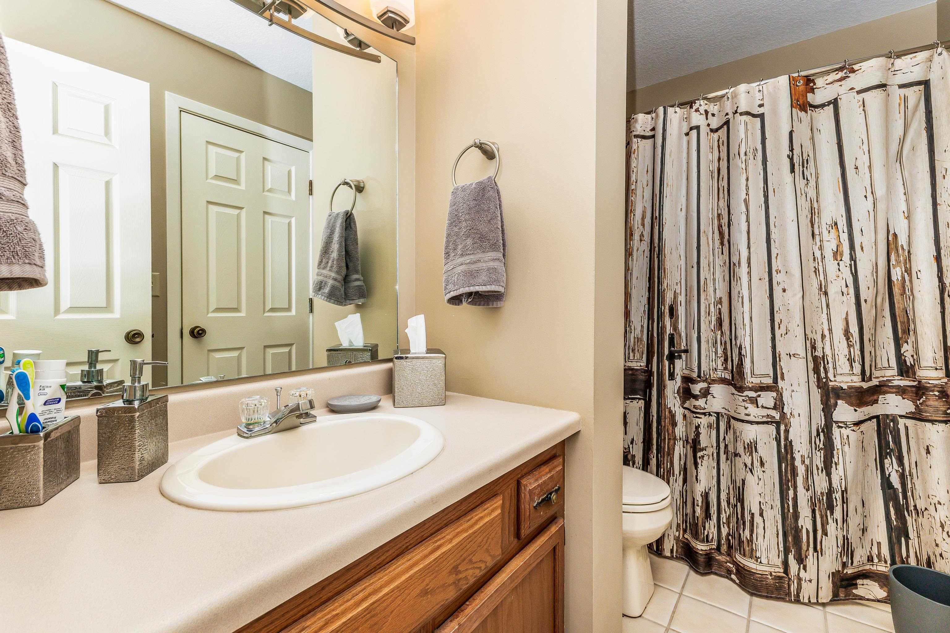4 Timberline Drive Galena, IL 61036 - Photo 8 of 32 a bathroom with a sink and a mirror