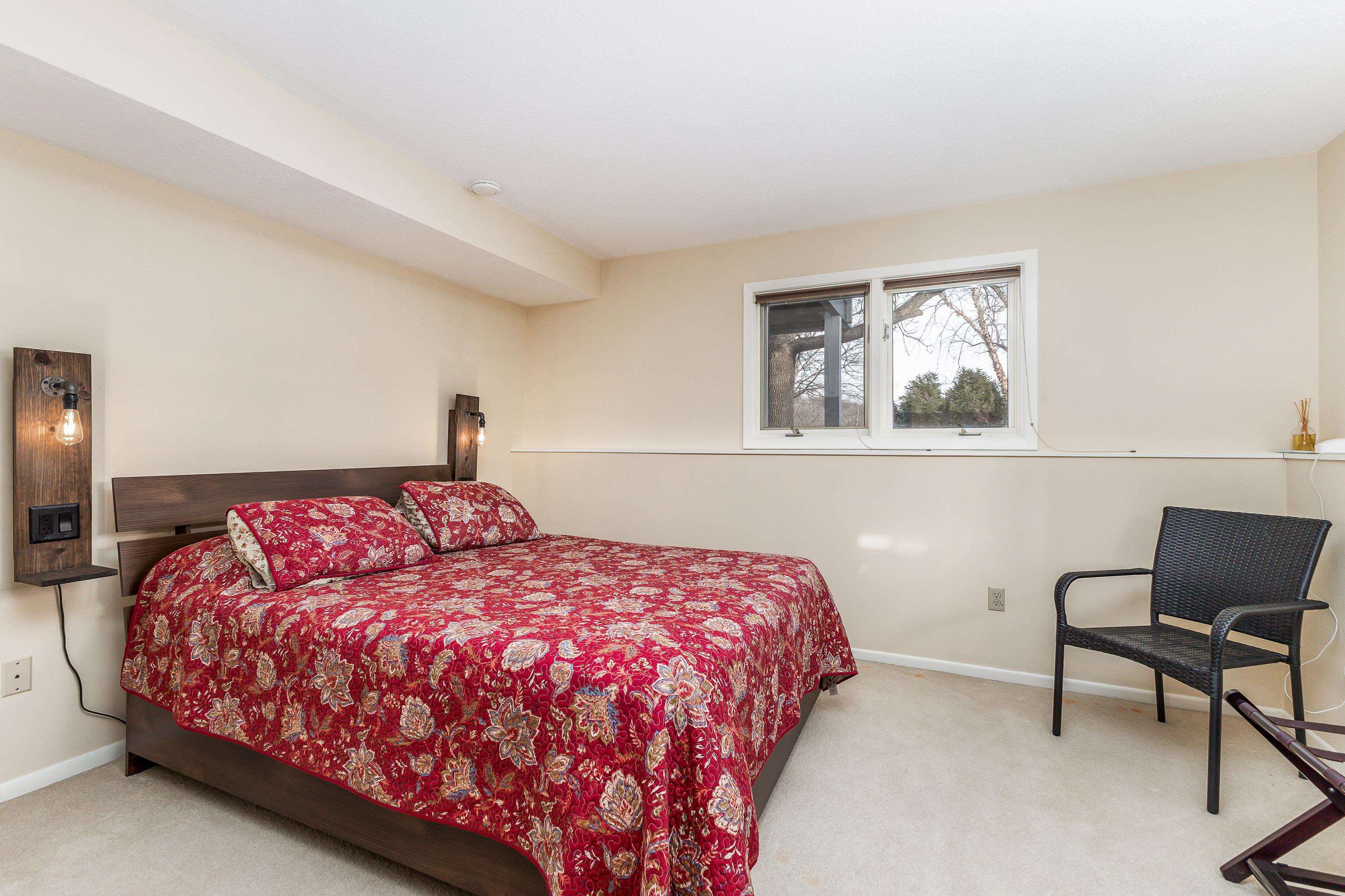 4 Timberline Drive Galena, IL 61036 - Photo 9 of 32 a bedroom with a bed and chair