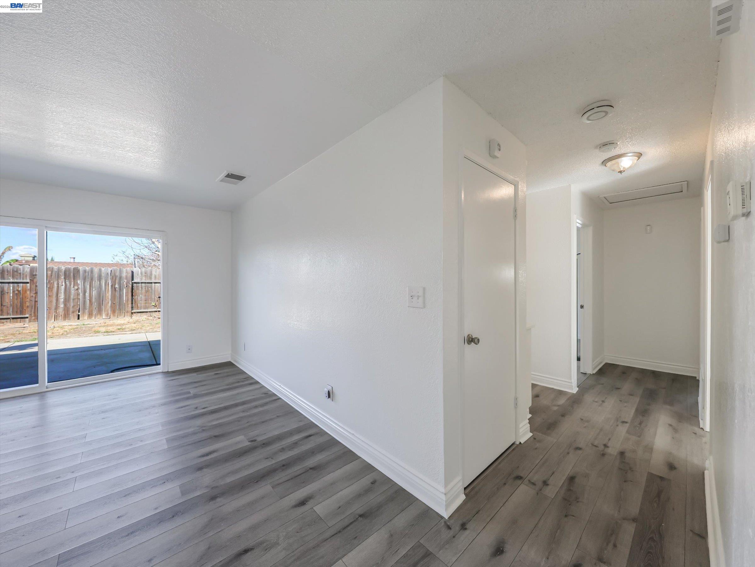 3432 Danielle Place Bay Point, CA 94565 - Photo 16 of 36 an empty room with wooden floor and windows