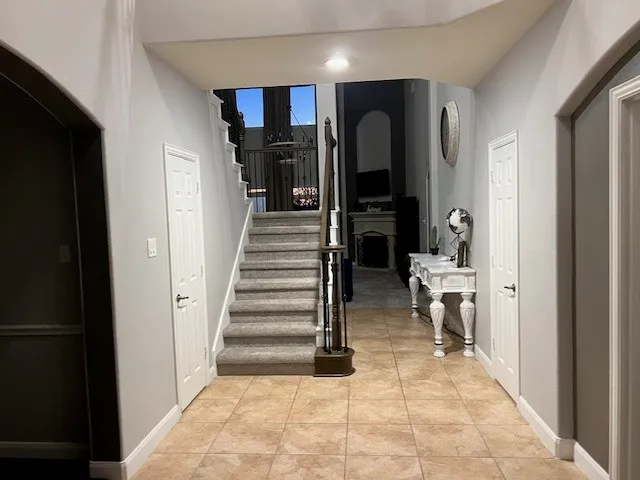 a view of a gallery with wooden floor