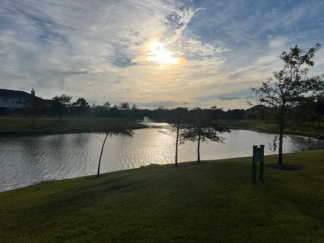 a view of lake with green space