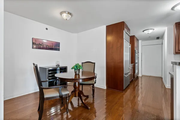 a view of a dining room with furniture and wooden floor