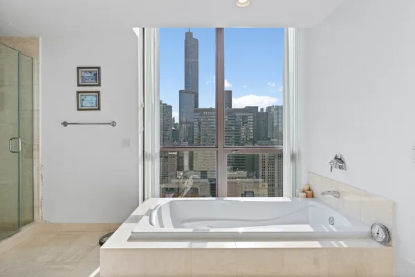 a white bath tub sitting next to a window