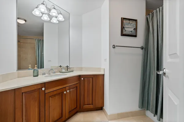 a bathroom with a double vanity sink and a mirror