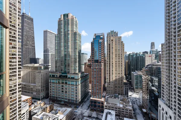 a view of city with tall buildings