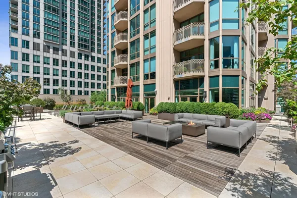 a view of a patio with couches and potted plants