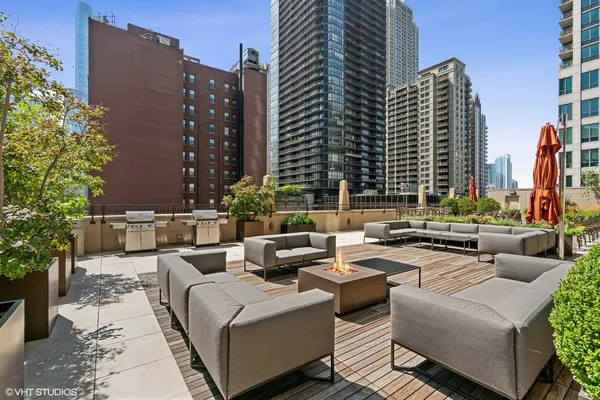 a view of a patio with couches and potted plants