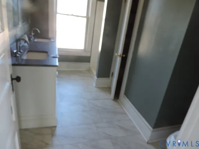 a view of a small house with backyard