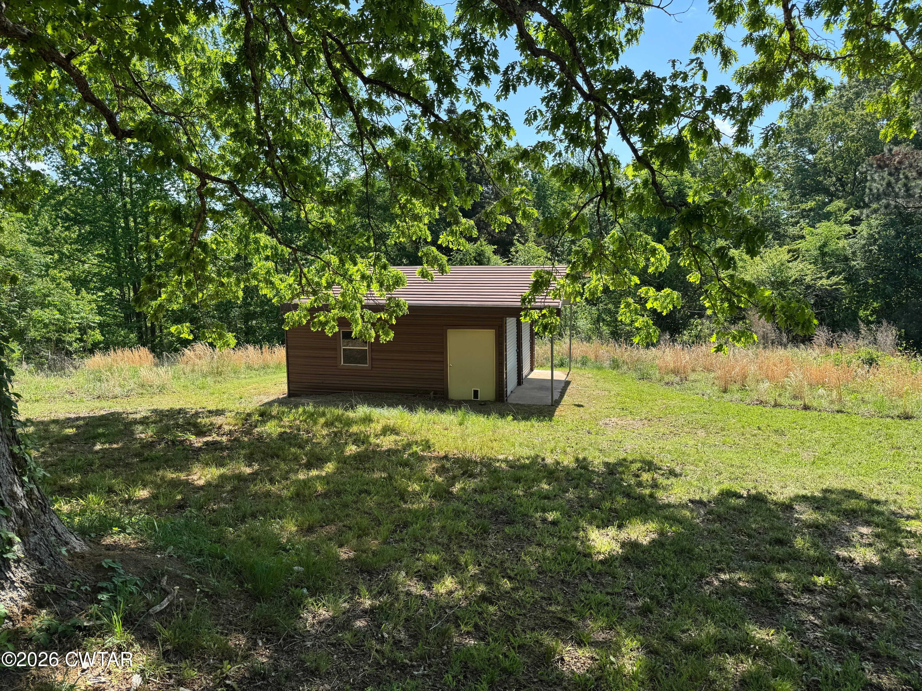 597 Broadway Road North Lexington, TN 38351 - Photo 13 of 15 a front view of a house with a yard