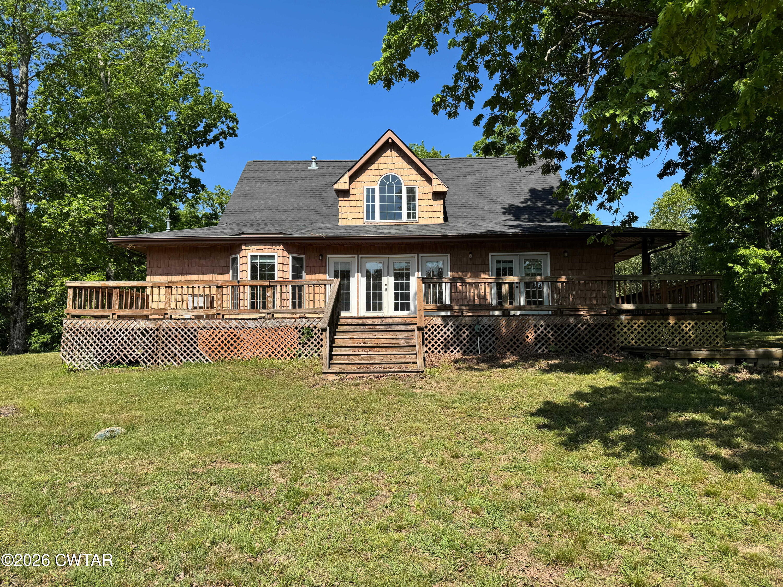 597 Broadway Road North Lexington, TN 38351 - Photo 14 of 15 a view of a house with backyard porch and sitting area