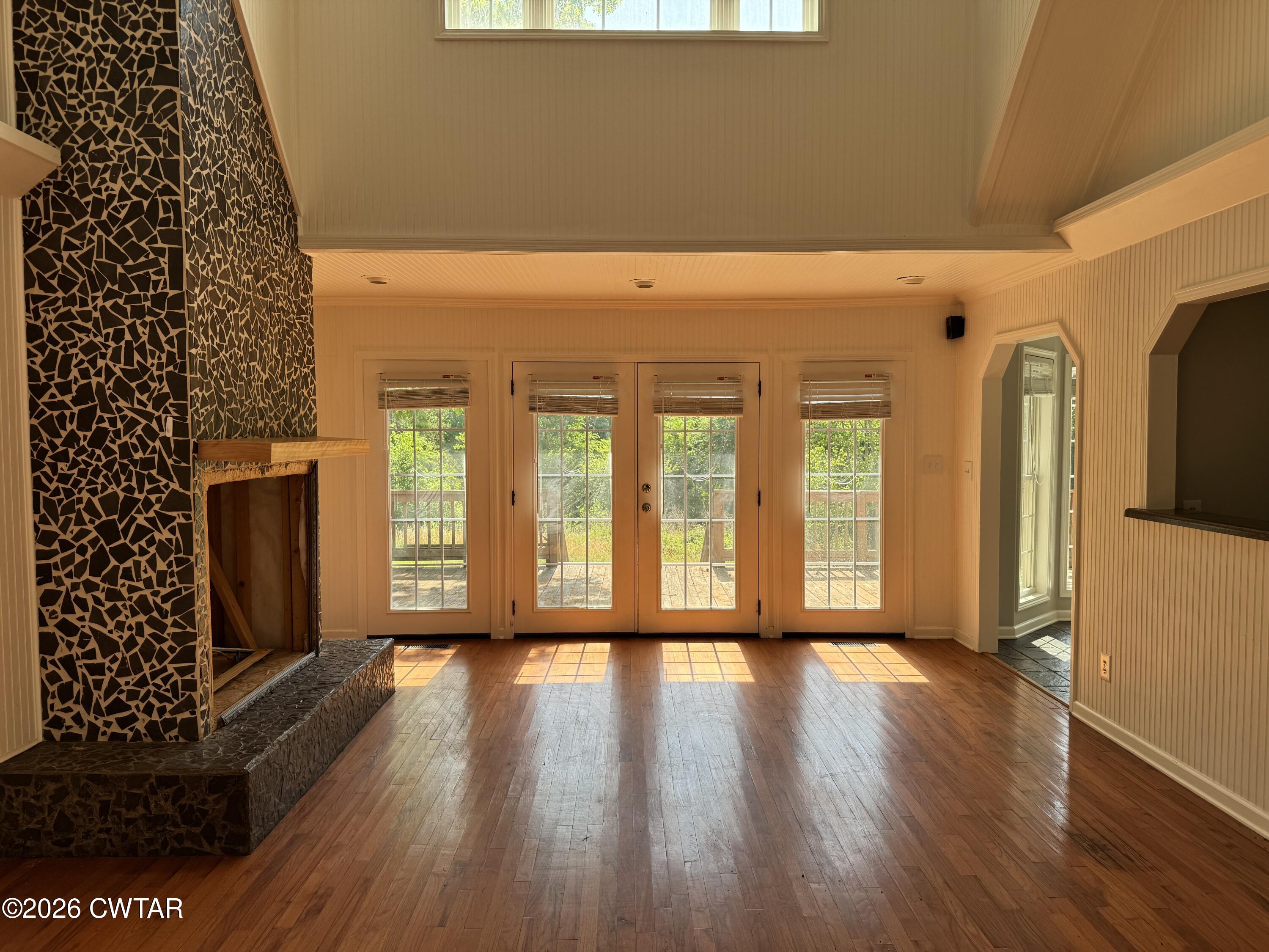 597 Broadway Road North Lexington, TN 38351 - Photo 5 of 15 wooden floor in an empty room with a window