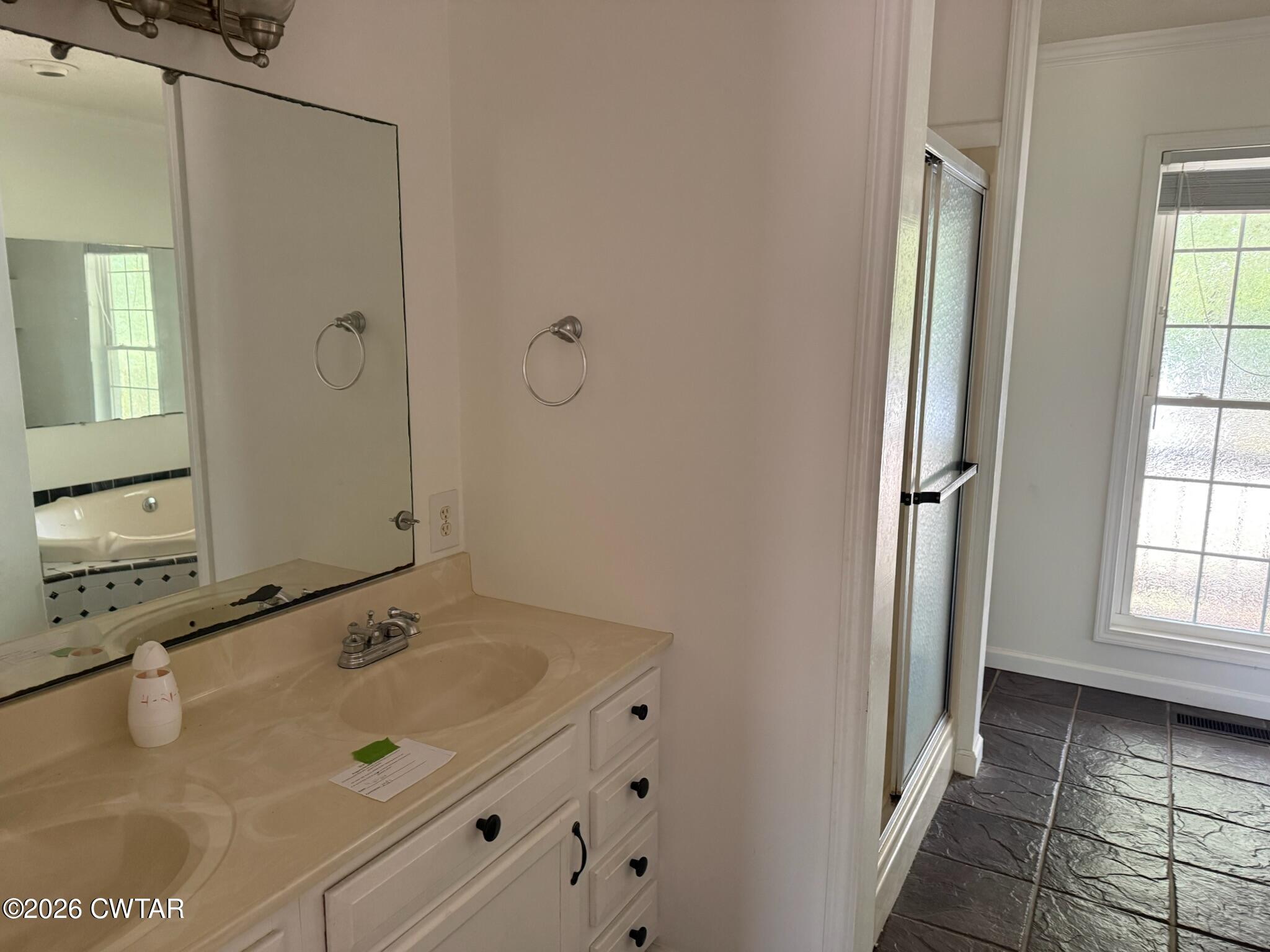 597 Broadway Road North Lexington, TN 38351 - Photo 9 of 15 a bathroom with a sink and a mirror