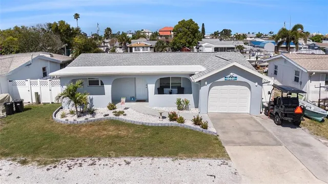 a view of a house with backyard porch and sitting area
