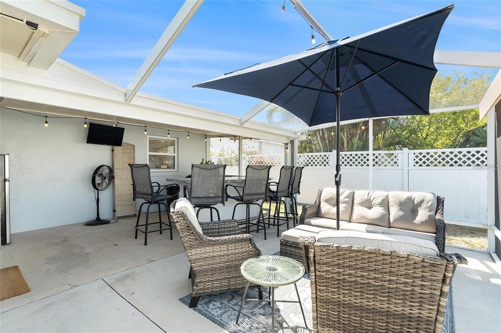 13401 Neptune Drive Hudson, FL 34667 - Photo 16 of 21 a outdoor space with patio the couches and chairs