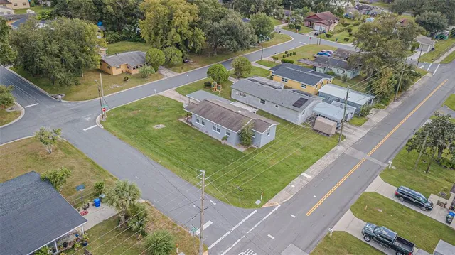 an aerial view of a house with a garden