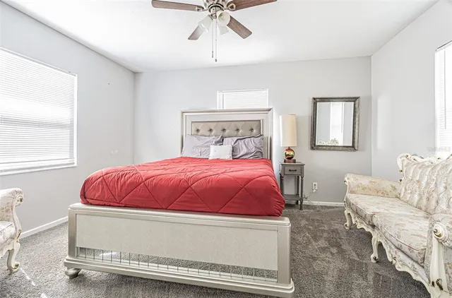 a bedroom with a bed and window